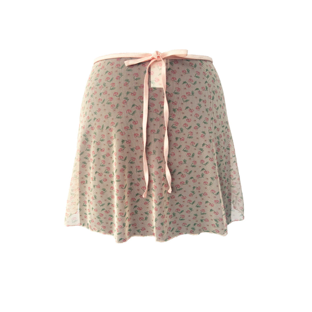 Falda corta rosa salmón con flores mini niña