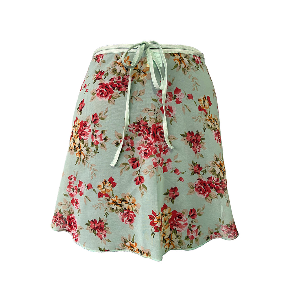 Falda corta flores menta niña