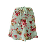 Falda corta flores menta niña