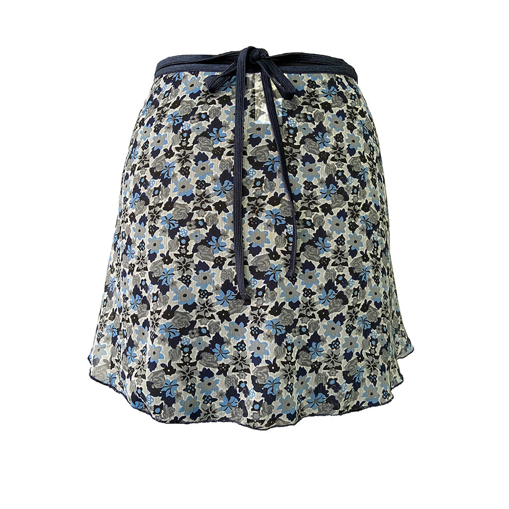 Falda corta flores blanca niña