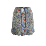 Falda corta crema con flores mini azul celeste